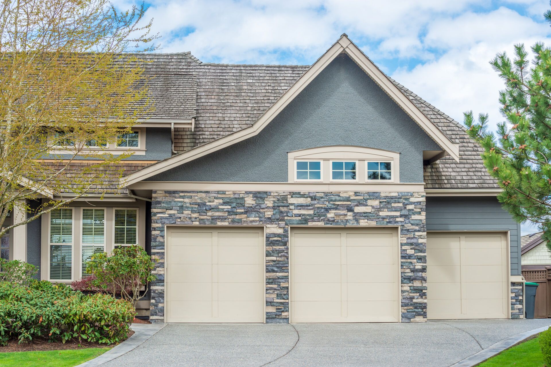 Luxury home with newly installed steel double garage door