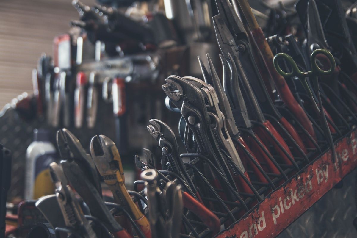 Professional garage door repair tools arranged in a flat lay